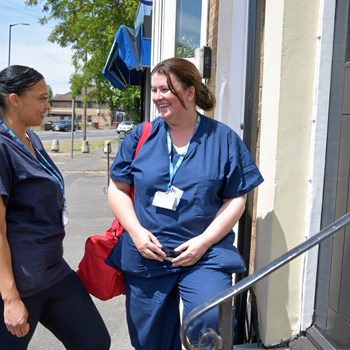 Picture of two nurses talking outside